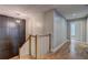 Hallway featuring hardwood floors, a modern light fixture, and a built-in storage unit at 158 Hemphill School Rd, Atlanta, GA 30331