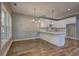 Kitchen with white cabinets, stainless appliances and long countertop at 158 Hemphill School Rd, Atlanta, GA 30331