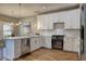 Kitchen with white cabinets, subway tile backsplash, stainless appliances at 158 Hemphill School Rd, Atlanta, GA 30331