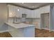 Bright kitchen features white cabinets, subway tile backsplash, quartz countertop at 158 Hemphill School Rd, Atlanta, GA 30331