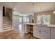 Kitchen with white cabinets, quartz countertop, stainless faucet and hardwood floors at 158 Hemphill School Rd, Atlanta, GA 30331