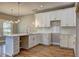 Kitchen with white cabinets, subway tile backsplash, and a stainless faucet at 158 Hemphill School Rd, Atlanta, GA 30331