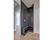 Hallway with dark gray built-in bench and storage at 158 Hemphill School Rd, Atlanta, GA 30331