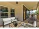 Inviting covered porch featuring stylish outdoor seating, perfect for relaxing and entertaining guests at 158 Hemphill School Rd, Atlanta, GA 30331
