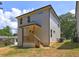 Rear view of a new house featuring a covered porch perfect for outdoor relaxation at 158 Hemphill School Rd, Atlanta, GA 30331