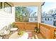 Cozy balcony offers a relaxing outdoor space with comfortable seating and privacy screens at 158 Village Green Ave, Woodstock, GA 30189