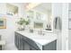 Elegant bathroom with double vanity, modern lighting, and stylish mirror at 158 Village Green Ave, Woodstock, GA 30189