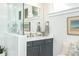 Modern bathroom features a walk-in shower with glass partition and neutral decor at 158 Village Green Ave, Woodstock, GA 30189