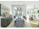 Dining room with large windows, modern chandelier, and seating for six at 158 Village Green Ave, Woodstock, GA 30189