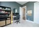 Stylish home office featuring built-in shelving, dual monitors, and decor for a comfortable workspace at 158 Village Green Ave, Woodstock, GA 30189