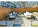 Stylish patio with comfortable seating, fire pit, and sleek design at 158 Village Green Ave, Woodstock, GA 30189