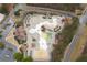 Stunning aerial view of a modern community waterpark with pools, slides, and lounging areas for residents at 214 Cedar Woods Way, Canton, GA 30114