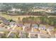 Stunning aerial view of homes in a lush community setting surrounded by trees and green spaces at 214 Cedar Woods Way, Canton, GA 30114