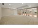 Expansive basement featuring carpeted floors and a transition into a wood-floored area at 214 Cedar Woods Way, Canton, GA 30114