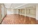 Expansive basement with wood-look flooring and natural light from multiple windows, ready for finishing and customization at 214 Cedar Woods Way, Canton, GA 30114