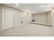 Partially finished basement area with neutral carpet and decor ready for customization at 214 Cedar Woods Way, Canton, GA 30114
