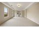 Bright bedroom with large windows, plush carpeting, and built-in shelving at 214 Cedar Woods Way, Canton, GA 30114