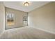 Spacious bedroom with neutral carpet, two windows, and natural light at 214 Cedar Woods Way, Canton, GA 30114