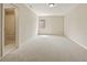 Bright bedroom featuring a window, neutral walls, and access to an ensuite bathroom at 214 Cedar Woods Way, Canton, GA 30114