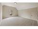 Well-lit bedroom features neutral walls, a window, and plush carpeting at 214 Cedar Woods Way, Canton, GA 30114