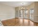 Cozy breakfast nook featuring hardwood floors and views of the screened in porch at 214 Cedar Woods Way, Canton, GA 30114