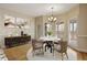 Charming dining area with natural light and views of the screened in porch at 214 Cedar Woods Way, Canton, GA 30114
