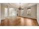 Elegant dining room with hardwood floors, detailed trim, and large windows at 214 Cedar Woods Way, Canton, GA 30114