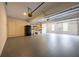 Spacious two-car garage with epoxy flooring, overhead storage, and natural light at 214 Cedar Woods Way, Canton, GA 30114