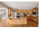 Spacious kitchen with stainless steel appliances and granite counters, seamlessly connected to living area at 214 Cedar Woods Way, Canton, GA 30114