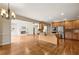 Open-concept kitchen with stainless appliances, granite counters, flowing to the living area at 214 Cedar Woods Way, Canton, GA 30114