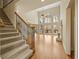 Bright living room boasts soaring ceilings, large windows, hardwood floors, and a fireplace at 214 Cedar Woods Way, Canton, GA 30114