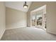 Well-lit living room featuring neutral walls, carpet, and a large bay window, creating a versatile living space at 214 Cedar Woods Way, Canton, GA 30114