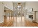 Light-filled living room features high ceilings, fireplace, hardwood floors, and outdoor views at 214 Cedar Woods Way, Canton, GA 30114