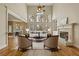 Inviting living room boasts a fireplace, seating, and natural light from large windows at 214 Cedar Woods Way, Canton, GA 30114