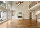 Spacious living room offers a fireplace, built-in shelves, and large windows with great view at 214 Cedar Woods Way, Canton, GA 30114