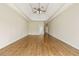 Bright main bedroom featuring tray ceiling, hardwood floors, and neutral paint palette at 214 Cedar Woods Way, Canton, GA 30114