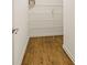 Organized walk-in pantry with white wire shelving and hardwood floors at 214 Cedar Woods Way, Canton, GA 30114