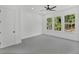 Bright bedroom with large windows offering views of the surrounding trees at 7043 Foundry Dr, Woodstock, GA 30188