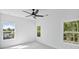 Well lit bedroom showcasing neighborhood views through the windows at 7043 Foundry Dr, Woodstock, GA 30188