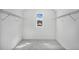 An ample walk-in closet ready for organization at 7043 Foundry Dr, Woodstock, GA 30188