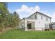 A covered patio with sliding glass doors, perfect for outdoor living and entertainment in the spacious backyard at 7043 Foundry Dr, Woodstock, GA 30188
