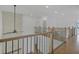 Bright foyer with hardwood floors, white walls, and a modern ceiling fan at 7043 Foundry Dr, Woodstock, GA 30188
