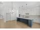 Contemporary kitchen with white cabinets, island with seating, and stainless steel appliances at 7043 Foundry Dr, Woodstock, GA 30188