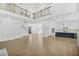 Open-concept living area showcasing sleek white cabinets, hardwood floors and stainless steel appliances at 7043 Foundry Dr, Woodstock, GA 30188