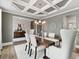 Elegant dining room features coffered ceiling, chandelier, and modern furniture on hardwood floors at 3710 Near Star Ln, Cumming, GA 30028