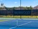 Community tennis court featuring the 'Briarwood' sign, showcasing the community's amenities at 3710 Near Star Ln, Cumming, GA 30028