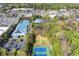 Overhead view featuring tennis courts and a building with solar panels in a wooded area at 495 Heritage Way, Atlanta, GA 30328