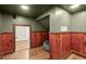 Basement with hardwood floors, wood paneling, and recessed lighting at 495 Heritage Way, Atlanta, GA 30328