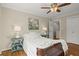 Charming bedroom with hardwood floors, a cozy bed, and a peaceful atmosphere at 495 Heritage Way, Atlanta, GA 30328