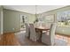 A dining room with a wood table, upholstered chairs, and natural light from the windows at 495 Heritage Way, Atlanta, GA 30328